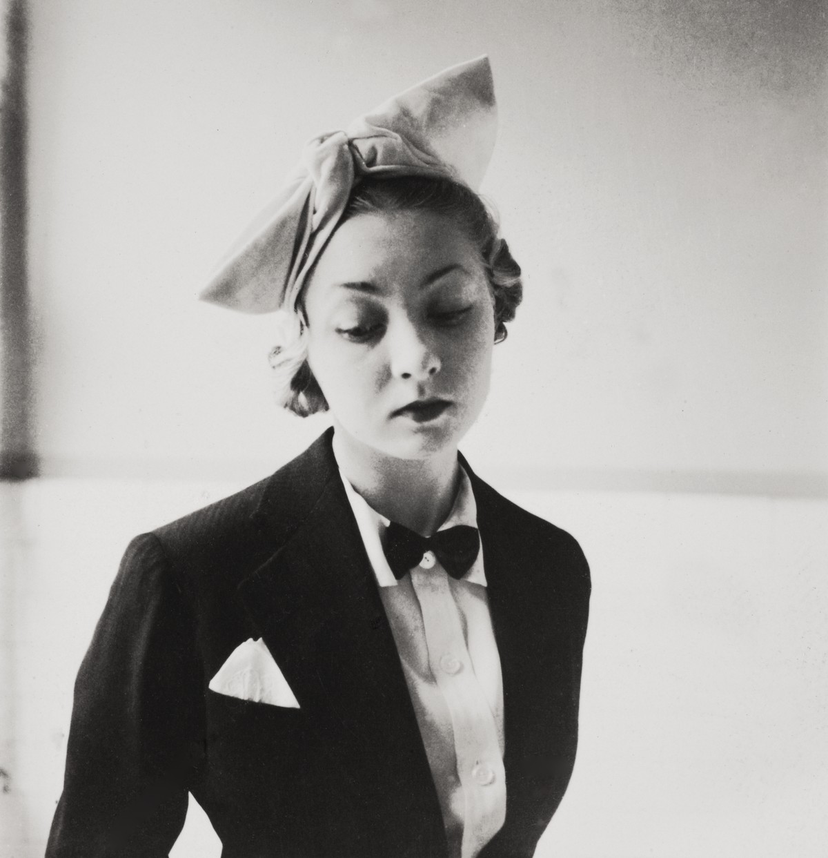 Baronova in a hat with jacket and bow tie