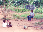 7. Dieudonné observing three babies playing