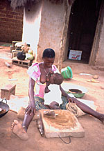 51. Toddler girl breast-feeding while standing up