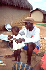 5. Kouakou Bah with toddler daughter